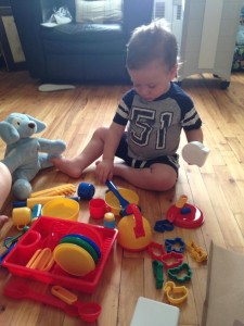 Idan, cold and all, playing with one of his birthday gifts