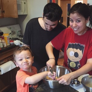 Baking cookies with his parents 